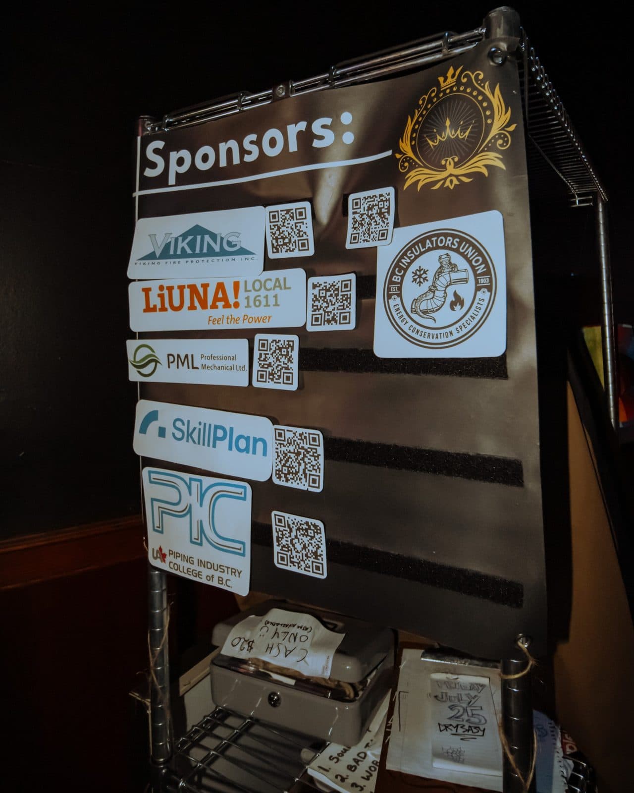 Champions of Hope sponsor board with sponsor logos and QR codes